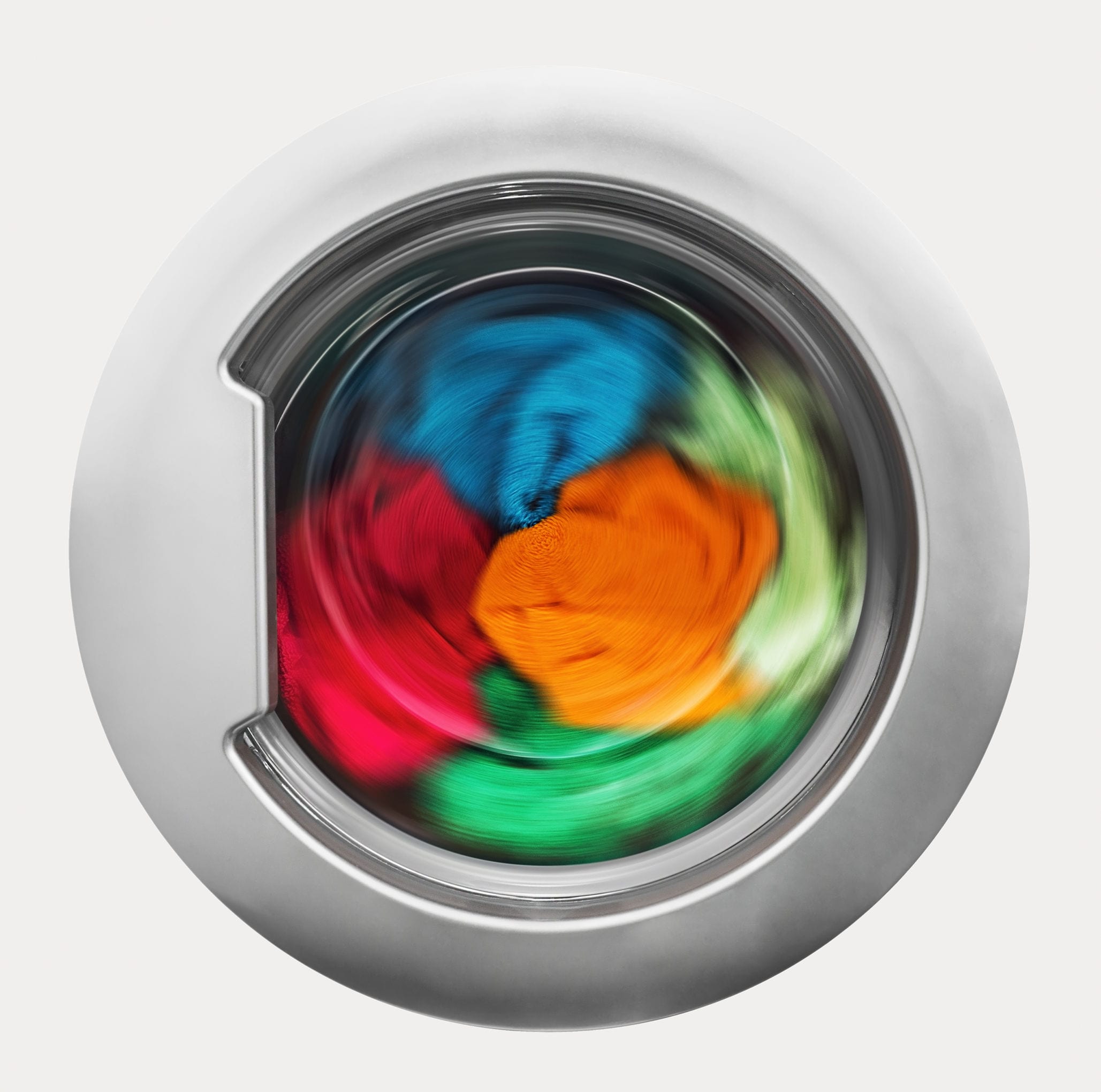 40593474 - washing machine door with rotating garments inside. focus in the center of dirty laundry and washing machine on the frame